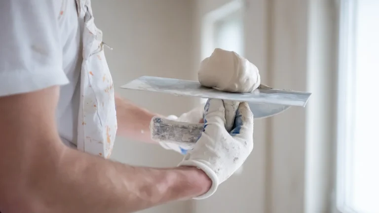 construction worker applies to spatula