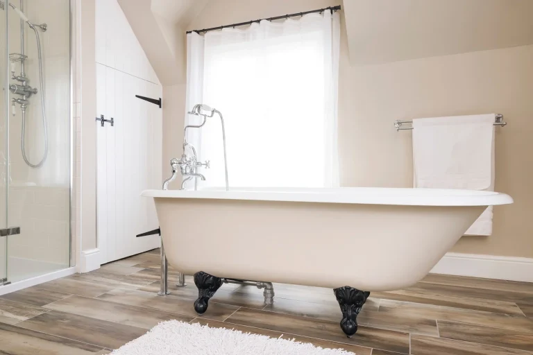white freestanding bathtub in renovated bathroom