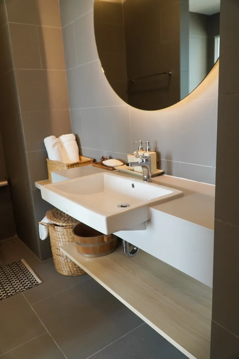 white washbasin in a renovated bathroom
