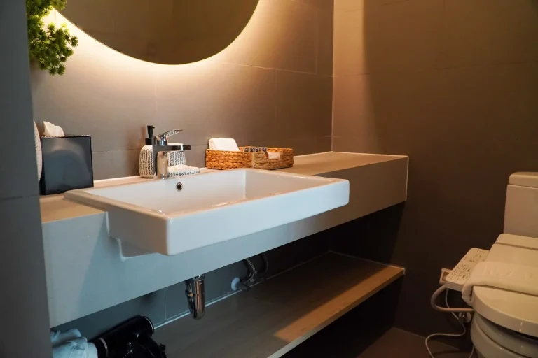 White washbasin in an elegant bathroom after renovation