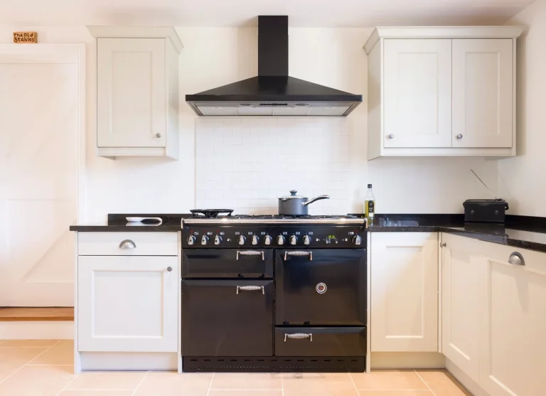 bright and cosy renovated kitchen with black appliances